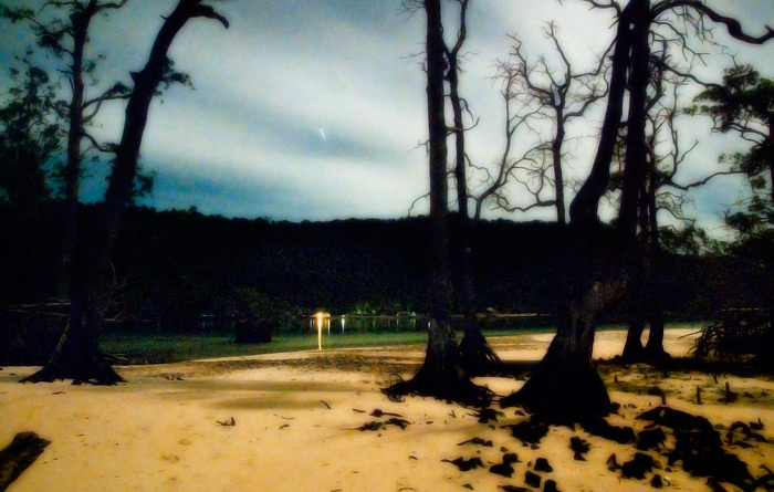 The lights of Mansuar's Yenbuba village by night. Electricity, phone and internet in Raja Ampat