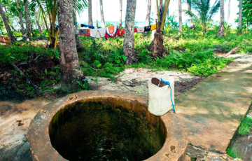 Water from the well. Sawinggrai, Gam Island, Raja Ampat